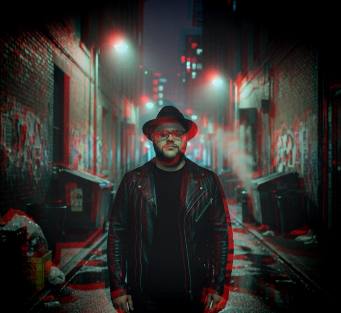 Stylised red and cyan portrait of Grant Morriss in a city alley
